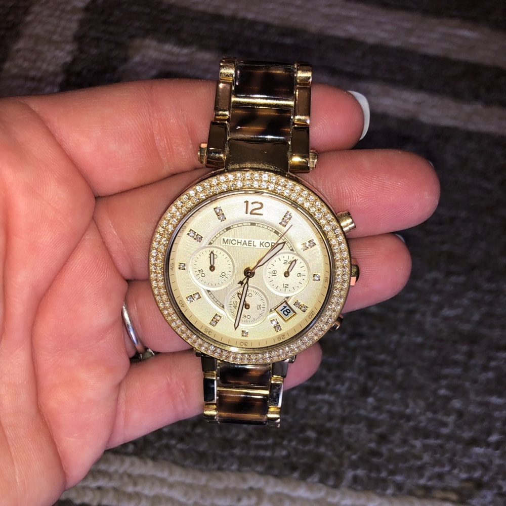 Gold and tortoise MK watch.